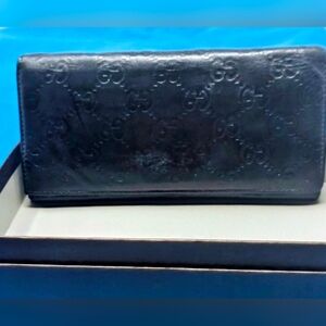 Gucci Guccissima long bifold leather wallet in black